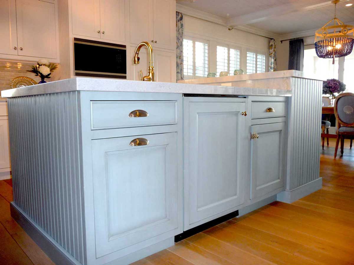 Baby blue cabinets complete island in center of a family's Bethany Beach, Delaware destination house.