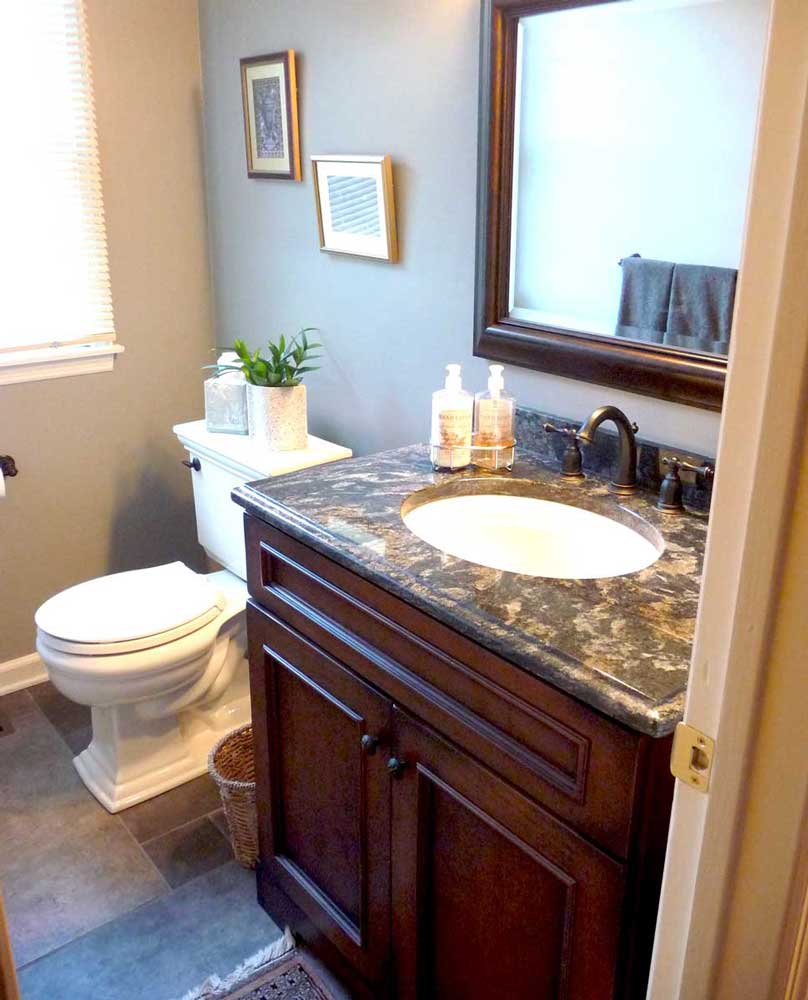 Single vanity with a sink and a mirror for a traditional powder room design in Delaware